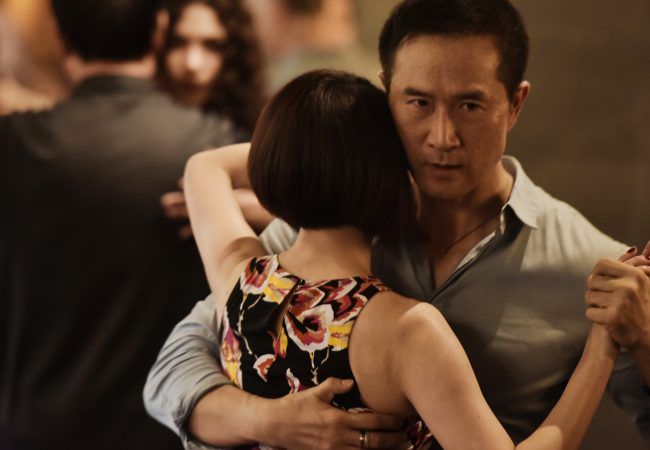 shallow focus photo of man and woman dancing