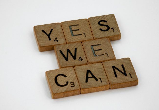 brown wooden letter blocks on white surface